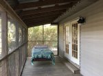 upstairs screened in porch with swing.jpg