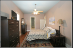 King Bed dresser and chest and blue rug.png